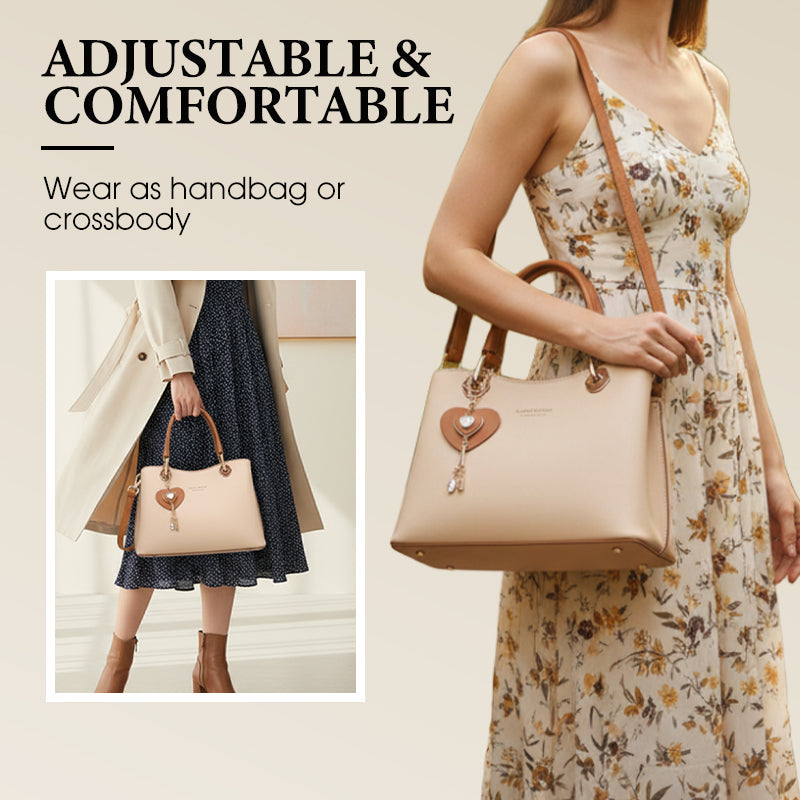 Elegant damväska med glänsande hjärtformad berlock